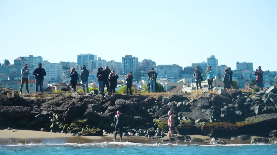 people standing on the beach of San Francisco Bay