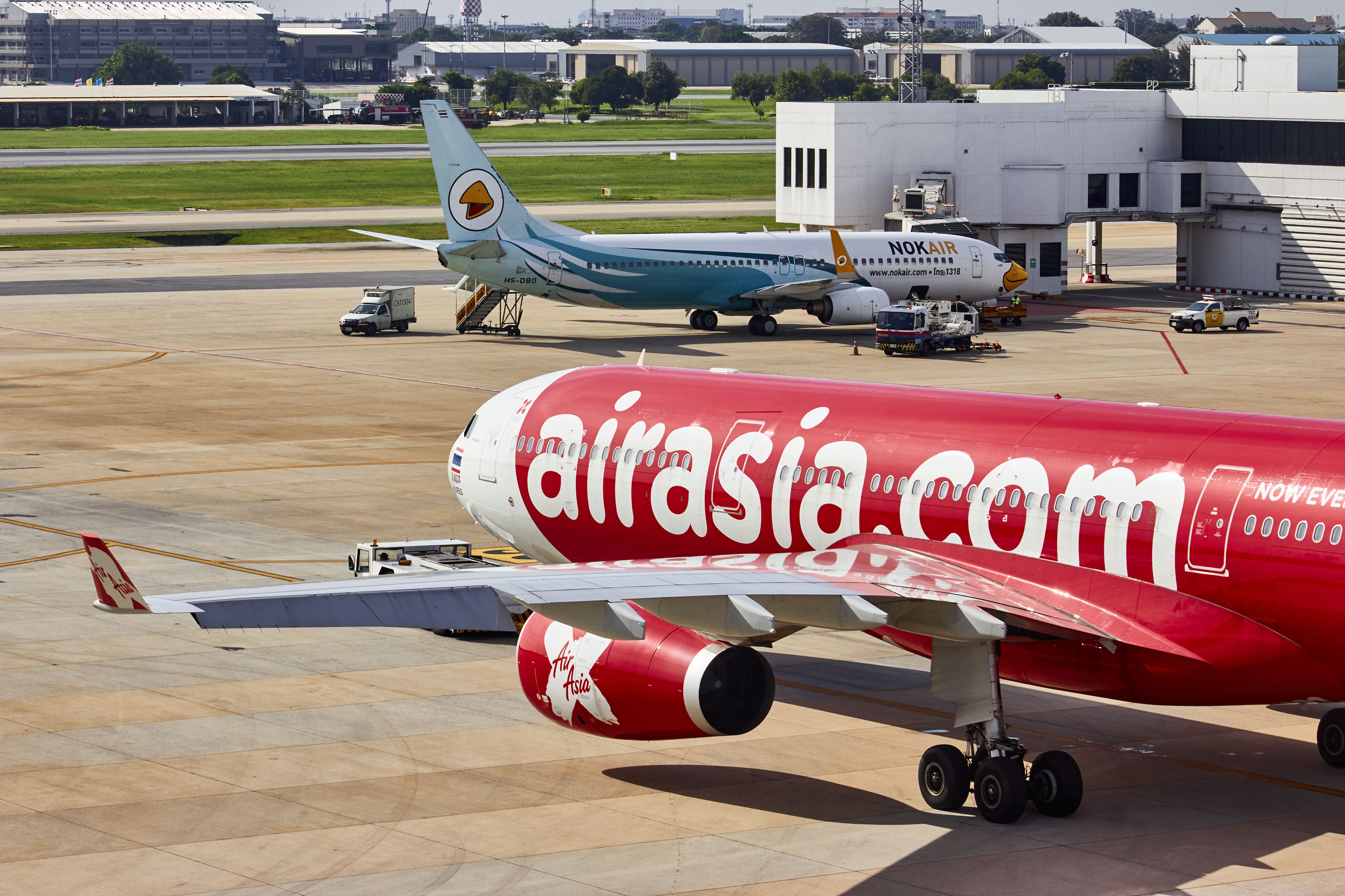 A Thai AirAsia X Airbus A330-300 (registration HS-XTE), leaving the gate.