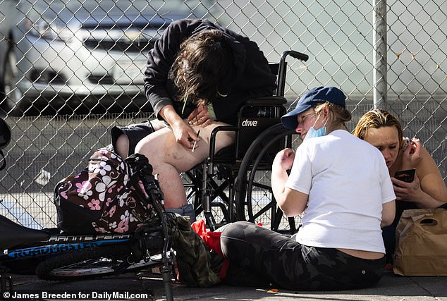 The tech worker from Austin was left stunned by his visit to the Bay Area, which is in the grip of a drugs crisis. Pictured: Homeless people using drugs in the city in 2022