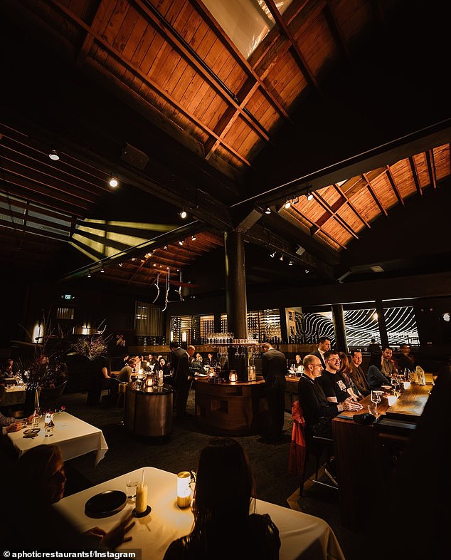 The exposed wood ceiling is designed to look like the inner ribs of a ship