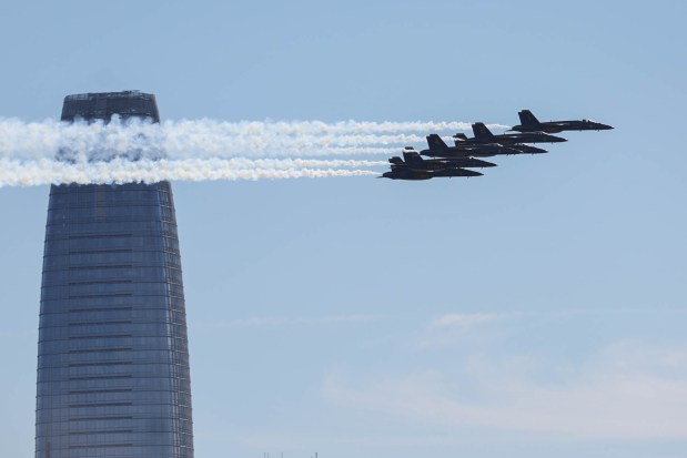 The U.S. Navy Blue Angels fly past the Salesforce Tower during the annual Fleet Week, as seen from Treasure Island in San Francisco, Calif., on Friday, Oct. 11, 2024. The air show and other attractions continue on Oct. 12 and 13. (Ray Chavez/Bay Area News Group)