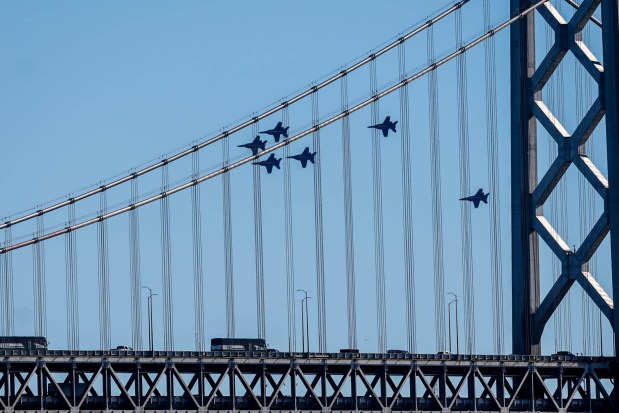 The U.S. Navy Blue Angels fly over the San Francisco-Oakland Bay Bridge during the annual Fleet Week, as seen from Treasure Island in San Francisco, Calif., on Friday, Oct. 11, 2024. The air show and other attractions continue on Oct. 12 and 13. (Ray Chavez/Bay Area News Group)