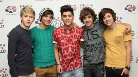 PA Media Niall Horan, Louis Tomlinson, Zayn Malik, Liam Payne and Harry Styles during a photocall in London 