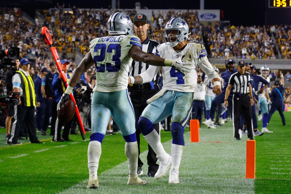 PITTSBURGH, PENNSYLVANIA - OCTOBER 06: Rico Dowdle #23 of the Dallas Cowboys celebrates a touchdown with Dak Prescott #4 during the fourth quarter against the Pittsburgh Steelers at Acrisure Stadium on October 06, 2024 in Pittsburgh, Pennsylvania. (Photo by Justin K. Aller/Getty Images)