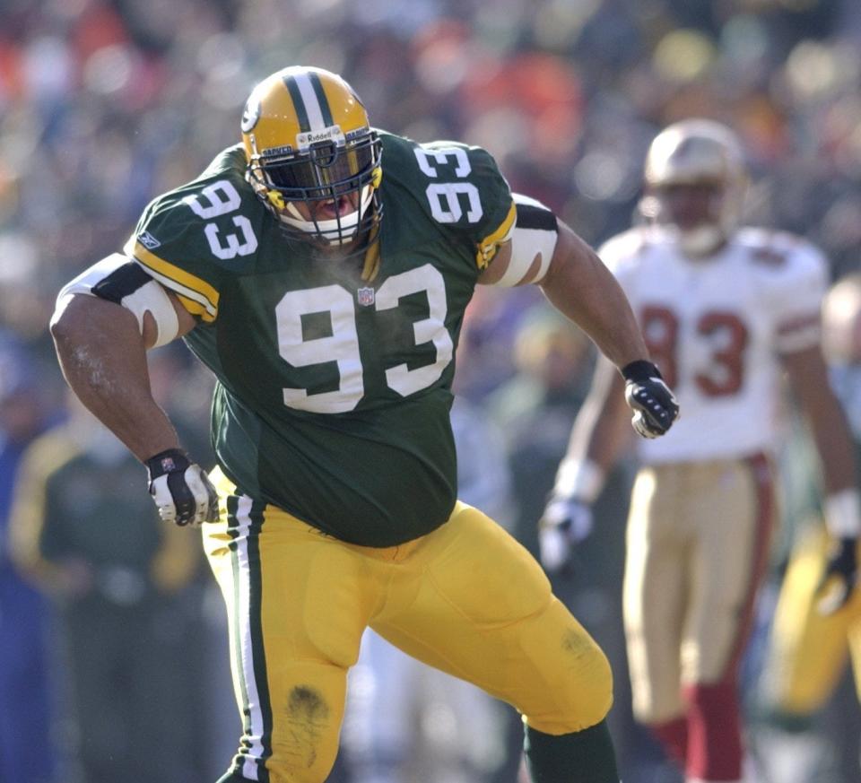 Green Bay Packers defensive tackle Gibert Brown celebrates his sacking of quarterback Jeff Garcia in the first play of the game. The Green Bay Packers defeated San Francisco, 25-15, on Sunday, Jan. 13th, 2002, at Lambeau Field, in the first round of the playoffs.