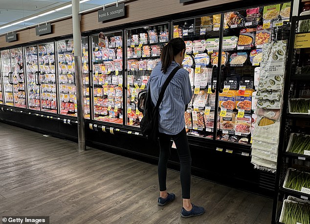 The store said the safety of its customers and staff was a concern, as well as rising theft (Pictured: A customer in a San Francisco Safeway store)