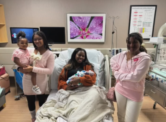 Sondra Williams smiles with her children. 