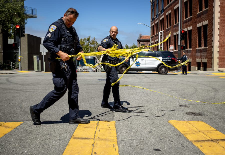 San Francisco Police Department officers remove tape at the scene of a shooting that left one high school student injured on August 21, 2024 in San Francisco. (Photo by Ethan Swope /Getty Images)