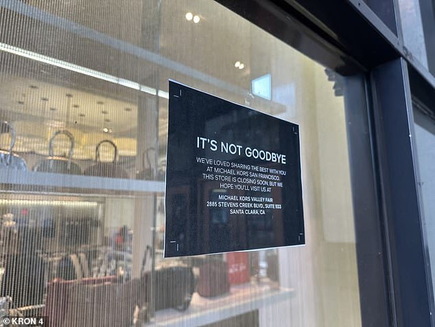 The sign on the Michael Kors store door announced the closure on Tuesday