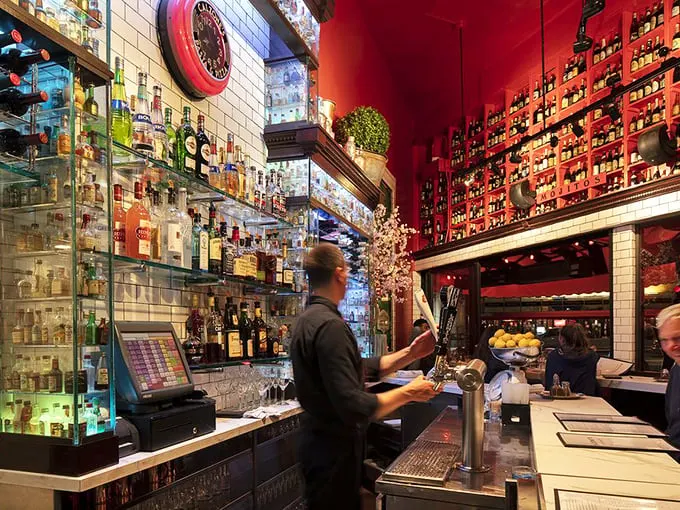 A bar that could make James Bond rethink his martini order! With its dazzling array of bottles, this spot's ready to shake up your garlic-infused cocktail dreams.