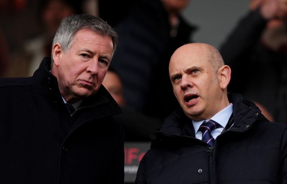 Rangers chairman and chief executive in the stands at a soccer match.