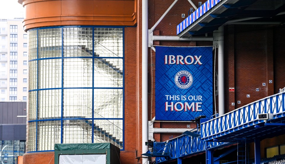 Ibrox Stadium exterior with a banner reading 