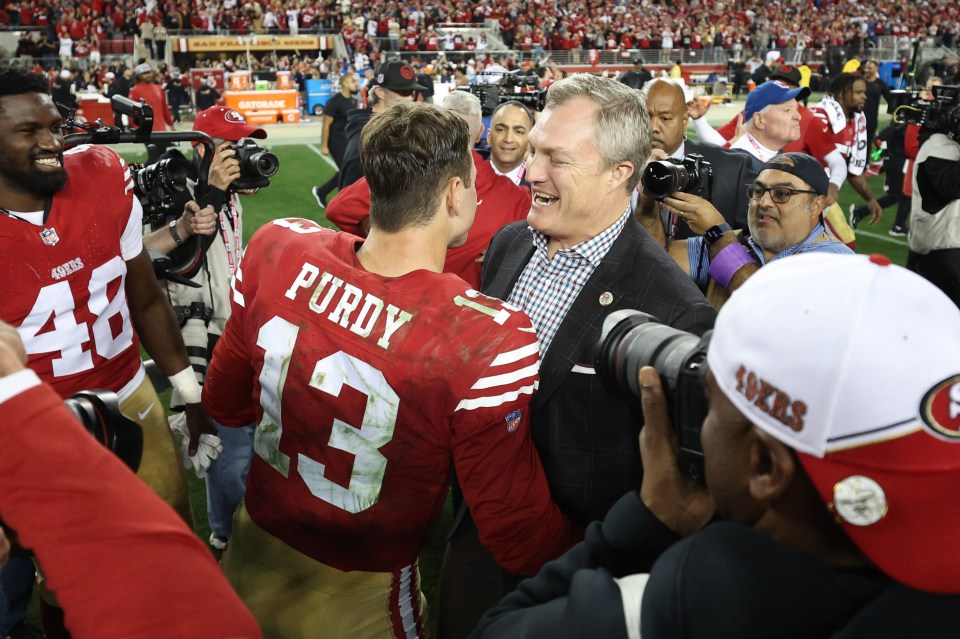 SANTA CLARA, CALIFORNIA - JANUARY 28: Brock Purdy #13 of the San Francisco 49ers celebrates with GM John Lynch after defeating the Detroit Lions 34-31 in the NFC Championship Game at Levi's Stadium on January 28, 2024 in Santa Clara, California. (Photo by Ezra Shaw/Getty Images)