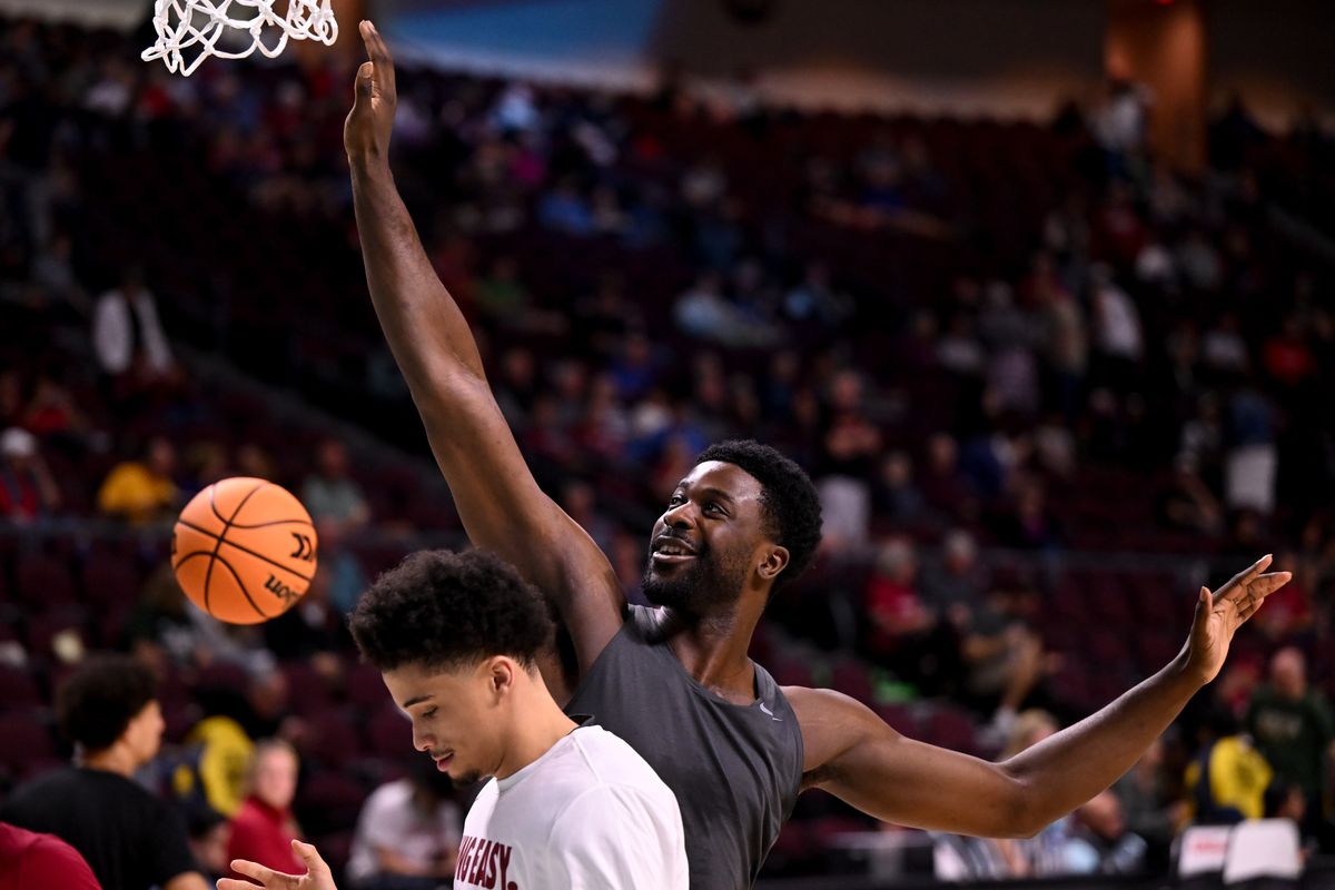 Washington State Cougars forward ND Okafor (22) jokes with guard Isaiah Watts (12) before the first half of the WCC Tournament quarterfinals against the San Francisco Dons on Sunday, Mar. 9, 2025, at Orleans Arena in Las Vegas, Nev.  (Tyler Tjomsland/The Spokesman-Review)